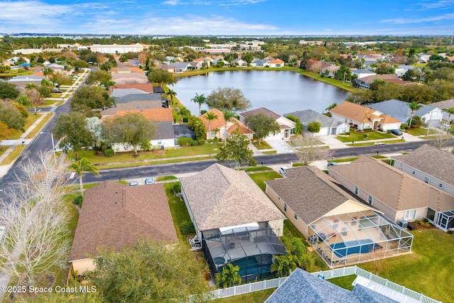 drone / aerial view with a water view