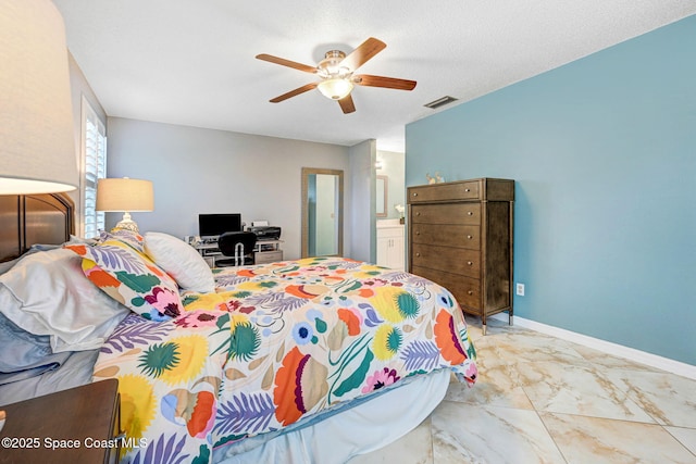 bedroom with ensuite bathroom, a textured ceiling, and ceiling fan