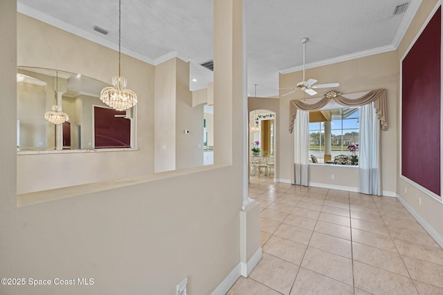 interior space featuring ceiling fan with notable chandelier, pendant lighting, crown molding, tile patterned floors, and a textured ceiling