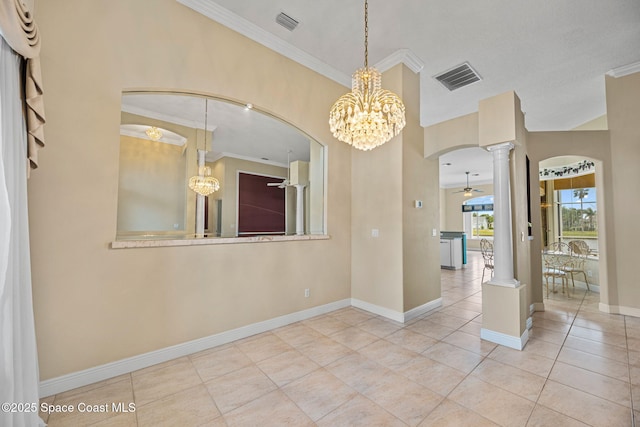 unfurnished room featuring decorative columns, ornamental molding, ceiling fan with notable chandelier, and light tile patterned floors