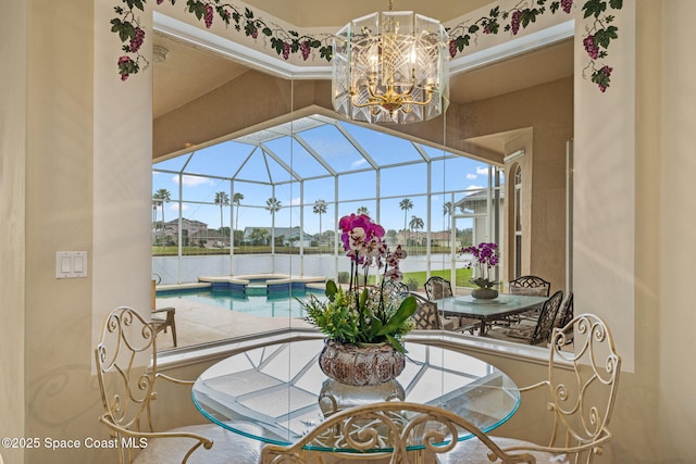 view of patio / terrace with a pool with hot tub and a lanai