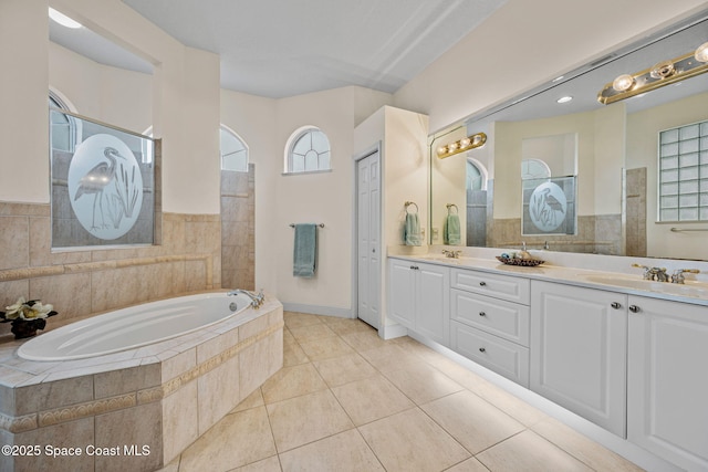 bathroom featuring vanity, plus walk in shower, and tile patterned flooring