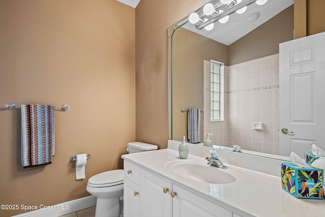 bathroom with vanity, tile patterned floors, and toilet