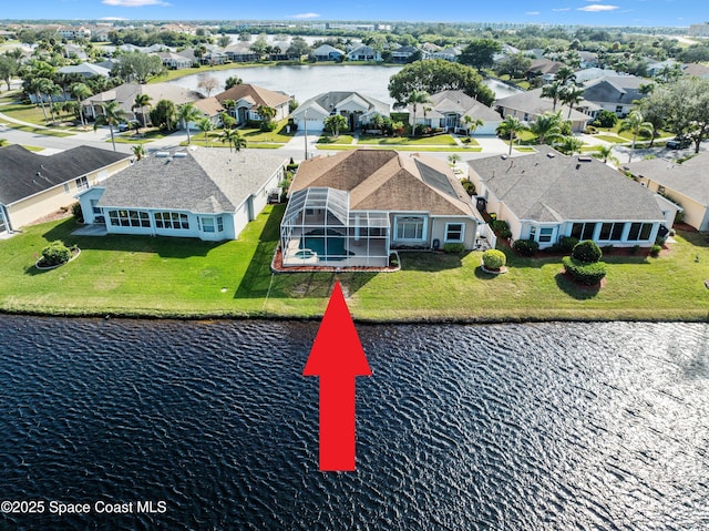 birds eye view of property featuring a water view