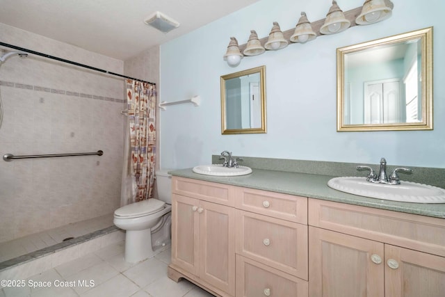 bathroom featuring vanity, toilet, tile patterned flooring, and a shower with shower curtain