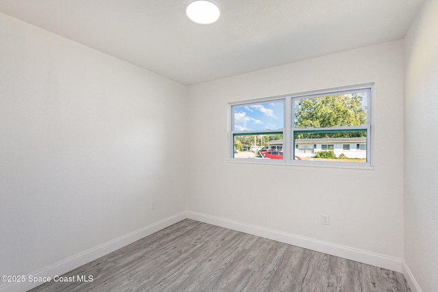 unfurnished room with light hardwood / wood-style floors