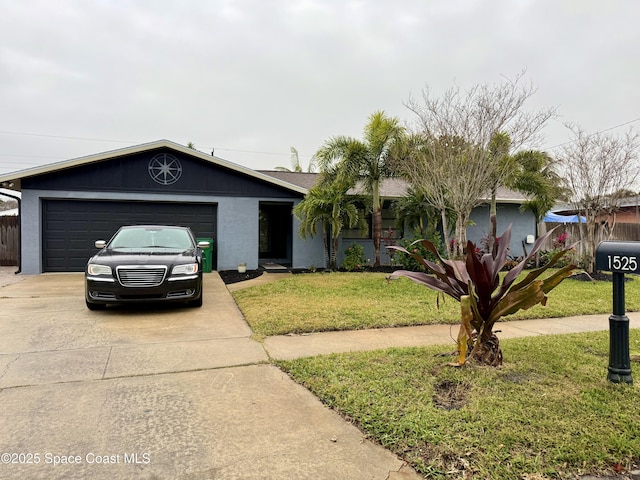 single story home with a front yard and a garage