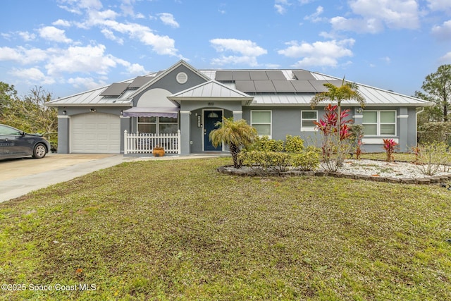 single story home featuring a garage, a front yard, and solar panels