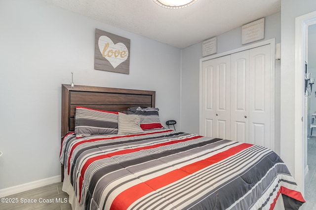 bedroom with a closet and light wood-type flooring