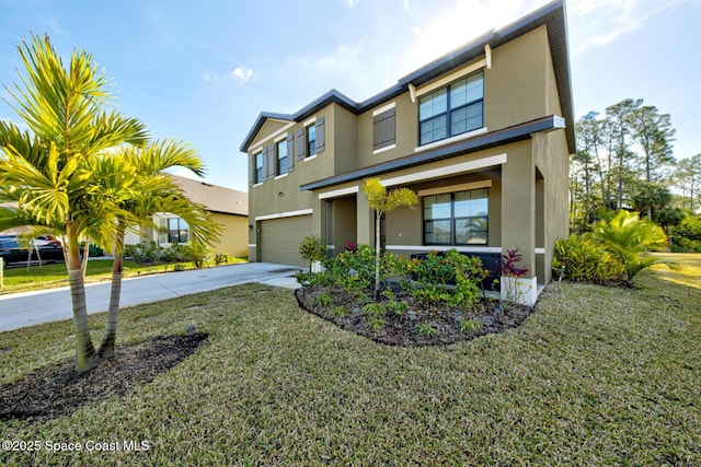 view of front of property with a garage and a front lawn