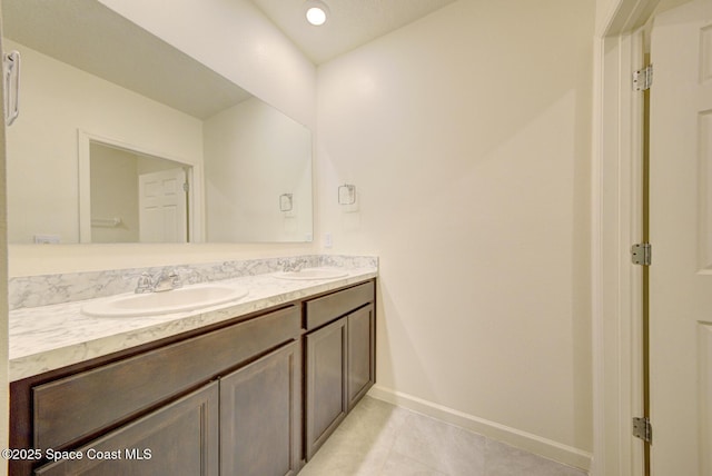 bathroom with tile patterned floors and vanity