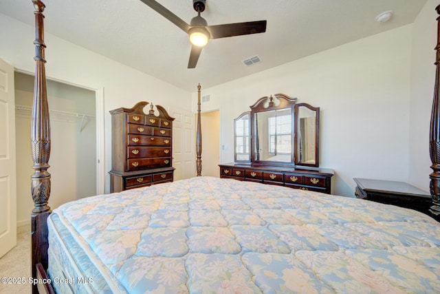 bedroom featuring light carpet, a closet, and ceiling fan