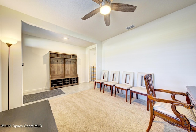 sitting room with light carpet and ceiling fan