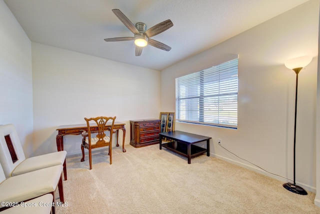 carpeted office with ceiling fan