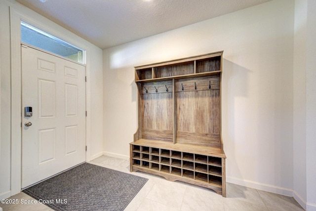 mudroom featuring light tile patterned floors