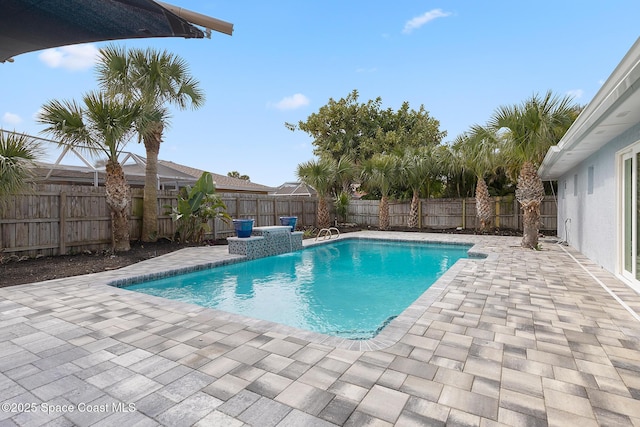 view of swimming pool with a patio area