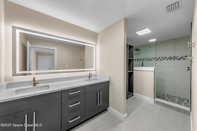 bathroom featuring vanity and tiled shower