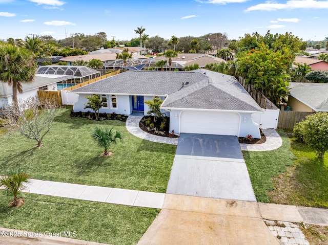 view of front facade with a garage and a front yard