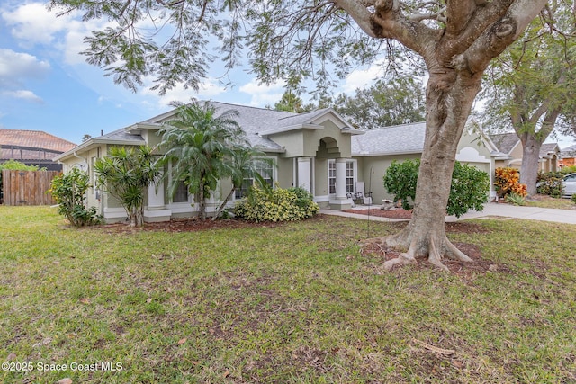 ranch-style home with a front lawn