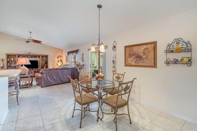 tiled dining area featuring lofted ceiling and ceiling fan