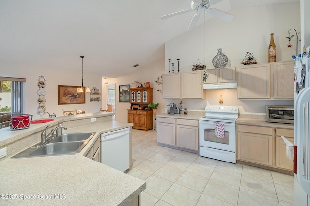 kitchen with light brown cabinets, decorative light fixtures, white appliances, vaulted ceiling, and sink