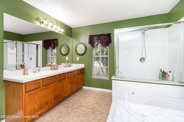 bathroom featuring an enclosed shower, vanity, and tile patterned flooring