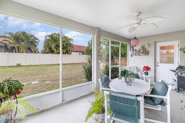 sunroom / solarium with ceiling fan