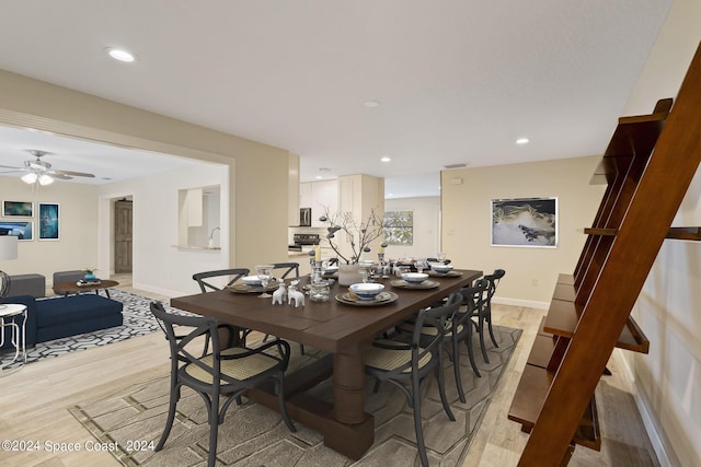 dining room featuring recessed lighting, light wood-type flooring, a ceiling fan, and baseboards