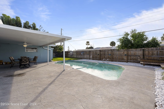 view of pool featuring a patio area, a fenced backyard, ceiling fan, and a fenced in pool