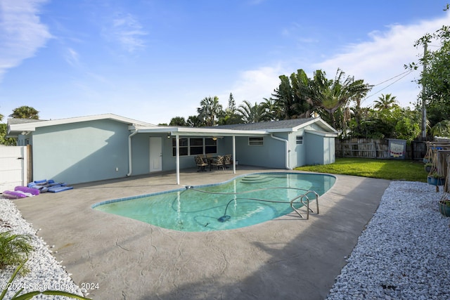 view of pool featuring a patio area, a fenced backyard, a fenced in pool, and a yard