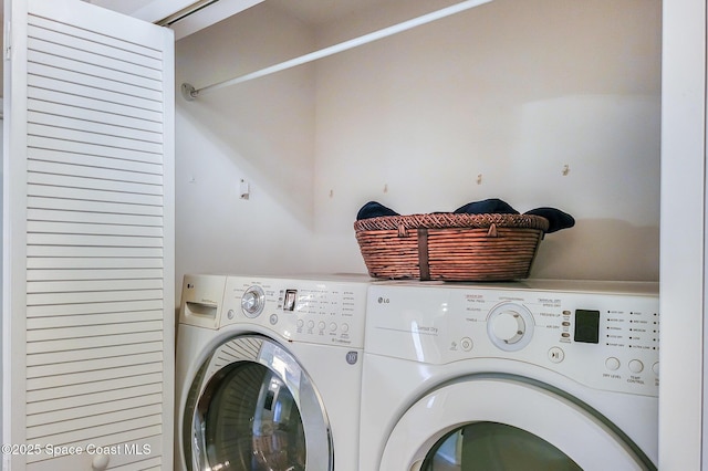 washroom featuring laundry area, washer and clothes dryer, and mail area