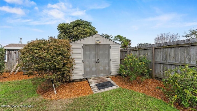 view of outbuilding featuring a yard