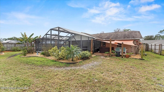 view of yard with glass enclosure