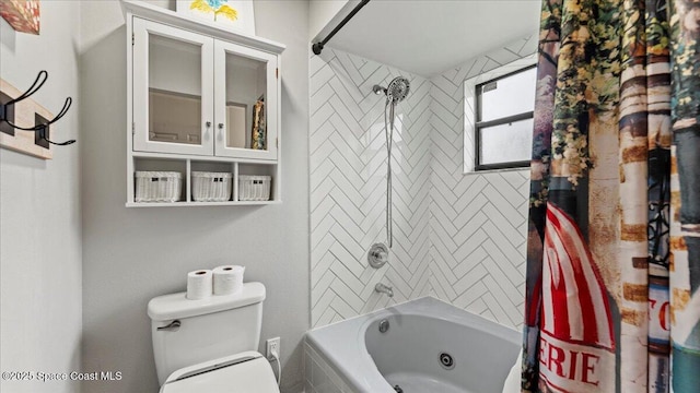 bathroom with shower / tub combo with curtain and toilet