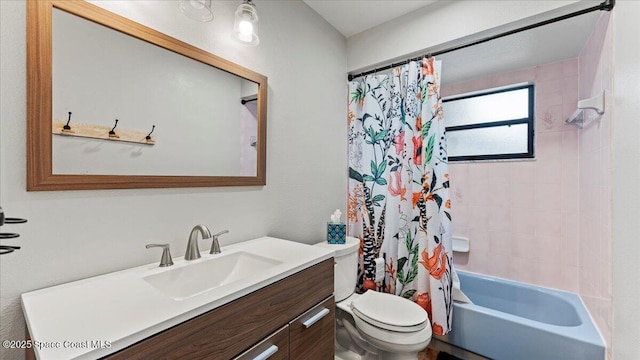 full bathroom with vanity, toilet, and shower / bath combo with shower curtain