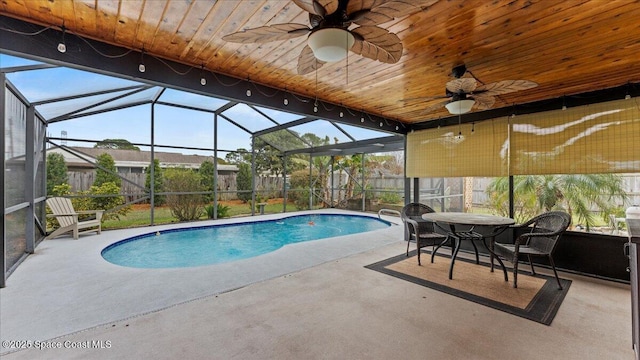 view of swimming pool with a patio and ceiling fan