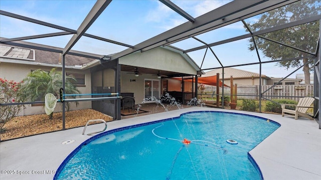 view of pool featuring ceiling fan, a lanai, and a patio