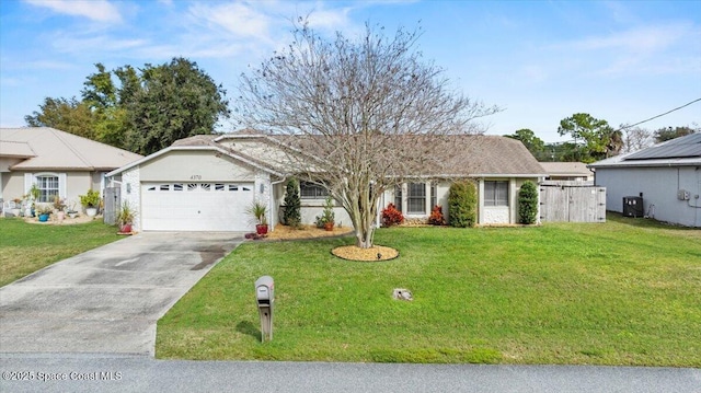 ranch-style house with a garage and a front yard