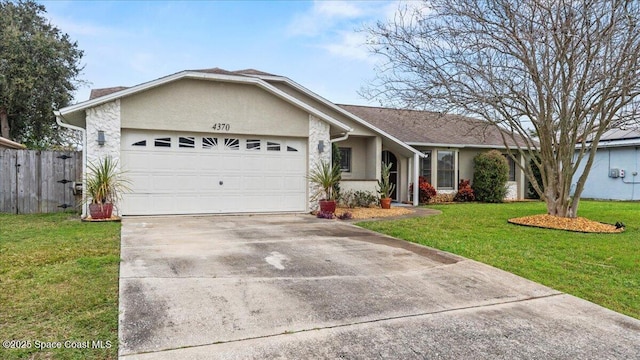 ranch-style home with a garage and a front lawn