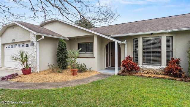 ranch-style home with a garage and a front lawn