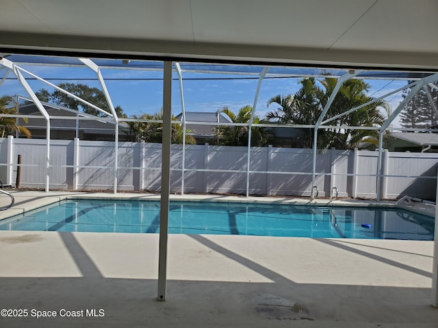 view of pool featuring a lanai