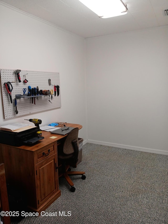 carpeted home office with baseboards