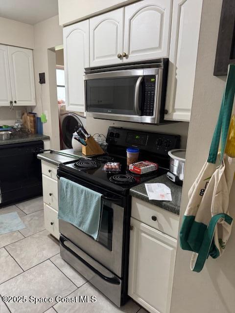 kitchen with light tile patterned floors, white cabinetry, and appliances with stainless steel finishes