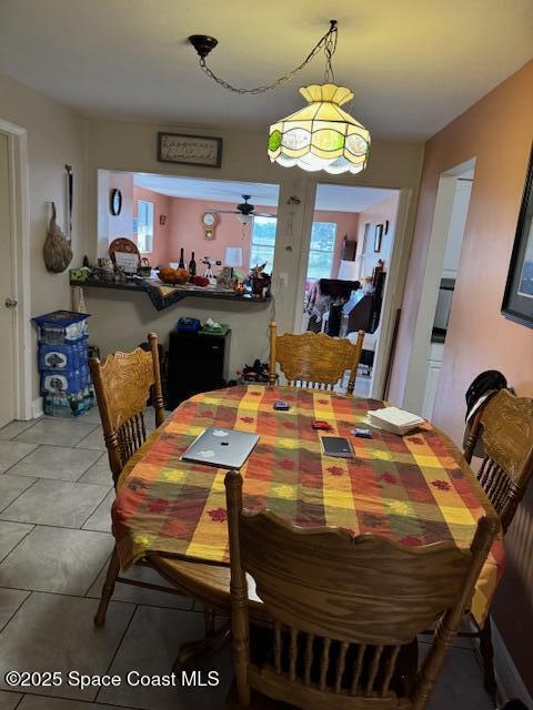 dining area featuring light tile patterned floors