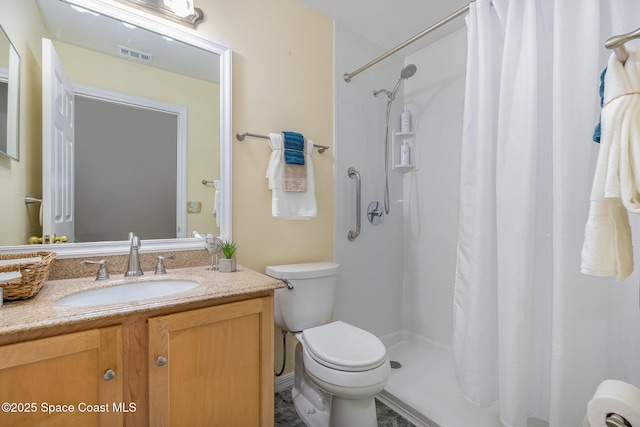 bathroom with vanity, toilet, and a shower with shower curtain