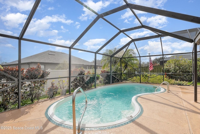 view of swimming pool featuring a playground, a patio, and glass enclosure