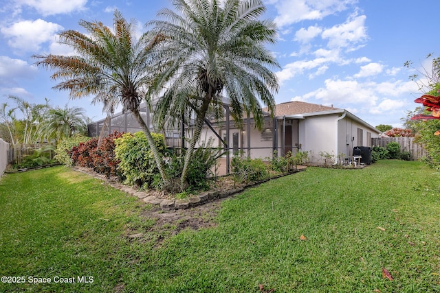 view of yard featuring a lanai