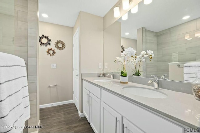 bathroom featuring vanity and hardwood / wood-style flooring