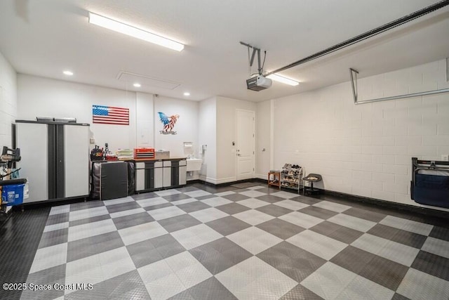 garage with sink and a garage door opener