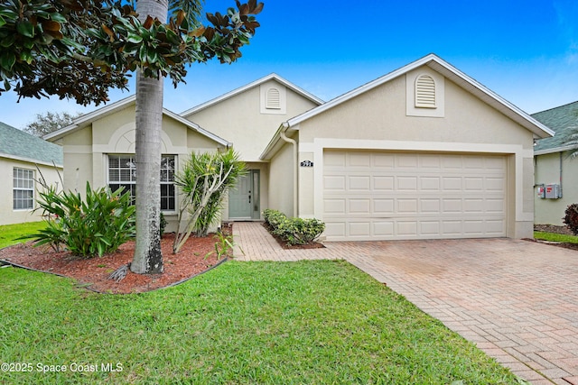 single story home with a front yard and a garage